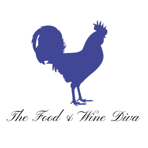 A blue rooster is sitting on the ground.