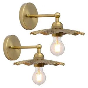A pair of brass wall lights with an adjustable arm.