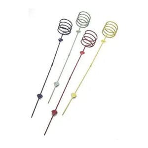 A group of four metal skewers with different colored handles.